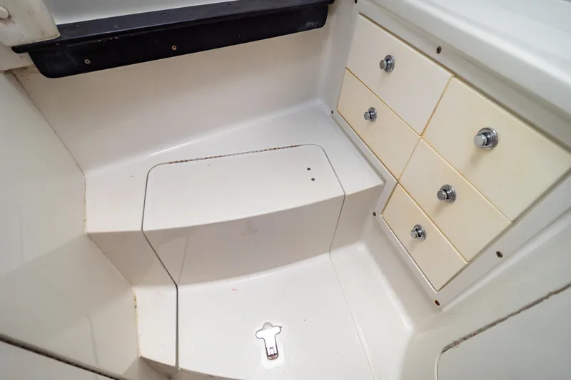  Yacht Photos Pics 2003 Intrepid 370 Cuddy cabin interior with storage drawers and step.