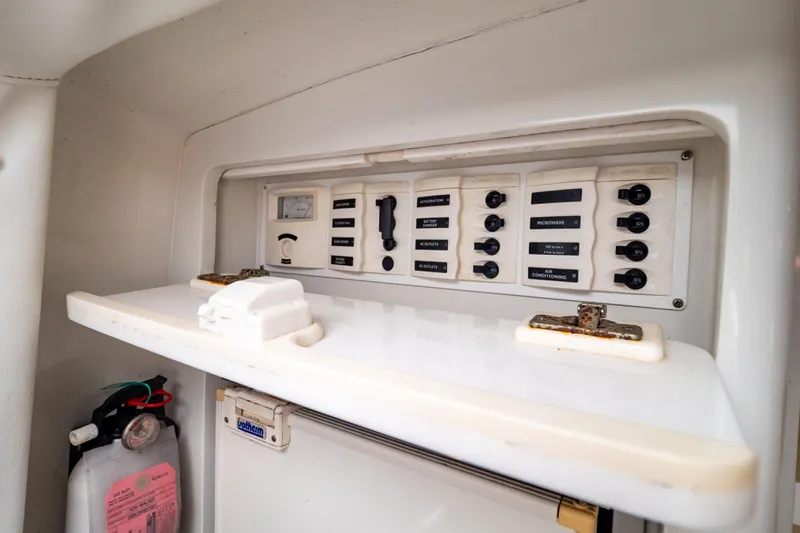  Yacht Photos Pics Control panel of a 2003 Intrepid 370 Cuddy boat with labeled switches.