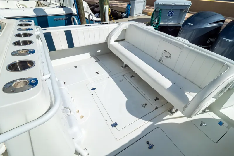  Yacht Photos Pics 2003 Intrepid 370 Cuddy boat interior with seating and storage compartments.