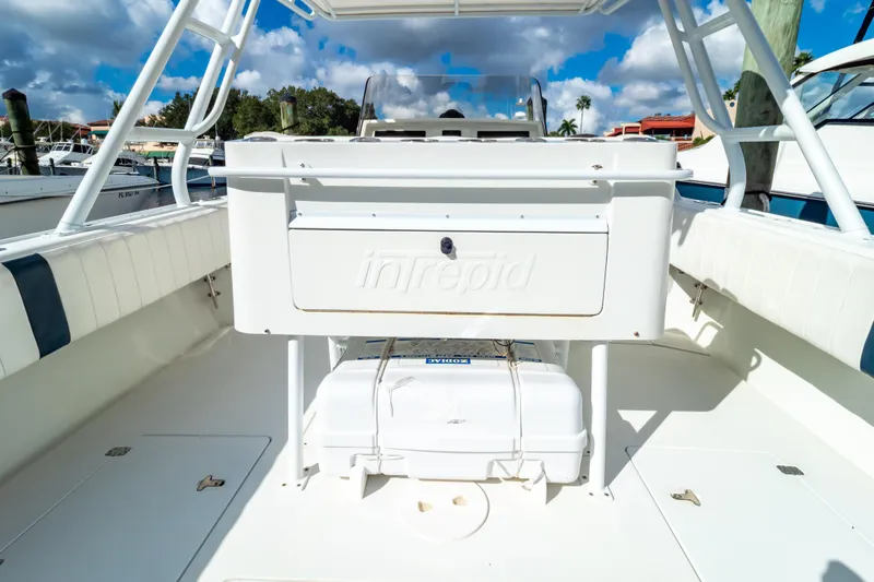  Yacht Photos Pics 2003 Intrepid 370 Cuddy boat interior with storage compartment and seating.