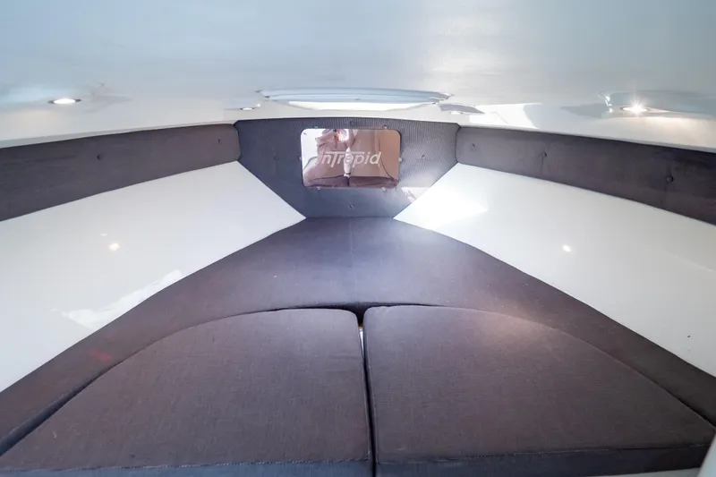  Yacht Photos Pics 2003 Intrepid 370 Cuddy cabin interior with cushioned seating and modern design.