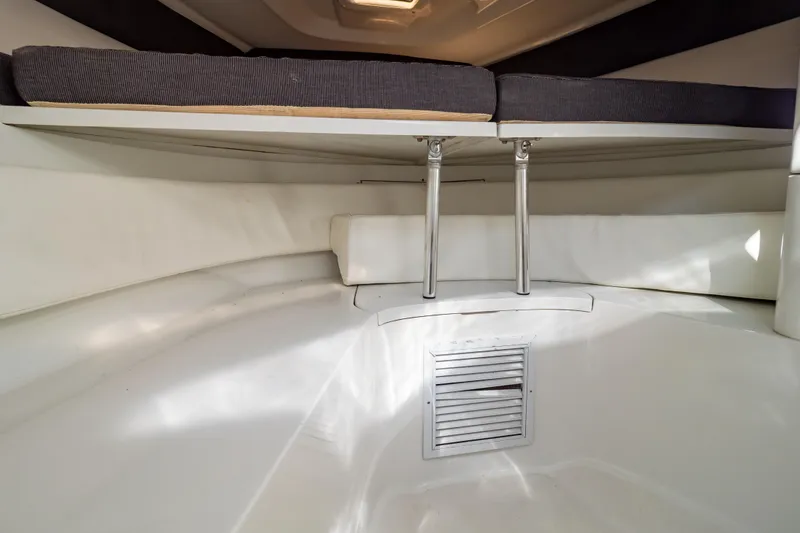  Yacht Photos Pics 2003 Intrepid 370 Cuddy cabin interior with cushioned seating and storage space.