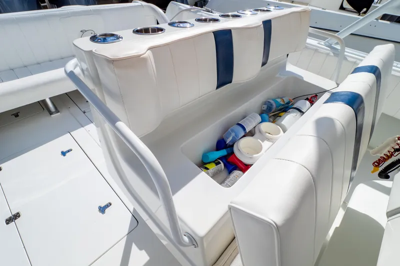  Yacht Photos Pics 2003 Intrepid 370 Cuddy boat interior with storage compartment and cup holders.
