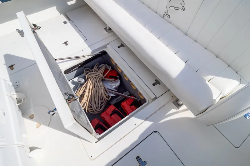  Yacht Photos Pics 2003 Intrepid 370 Cuddy boat storage compartment with rope and equipment.