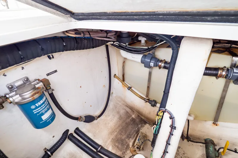  Yacht Photos Pics Engine compartment of a 2003 Intrepid 370 Cuddy boat, showing Yamaha fuel filter and hoses.