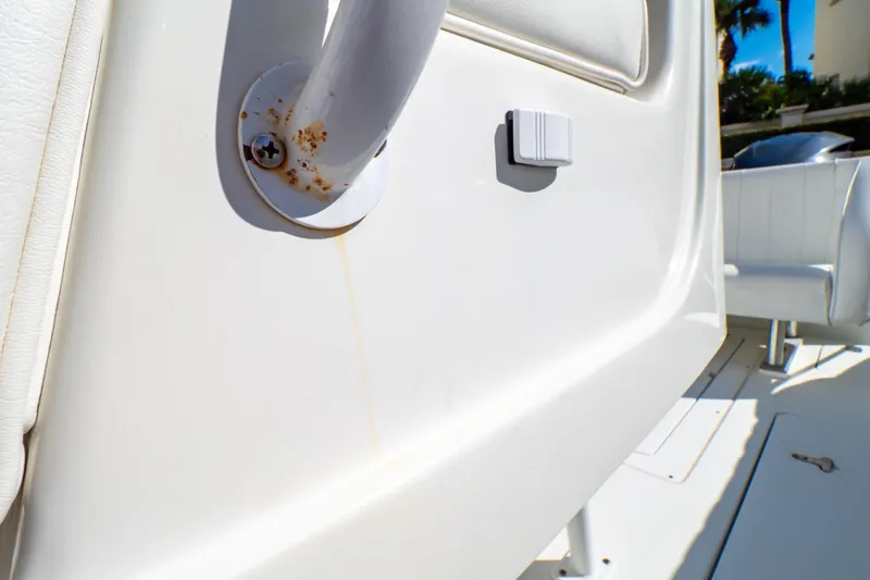  Yacht Photos Pics Close-up of a 2003 Intrepid 370 Cuddy boat interior, showing a rusted screw detail.