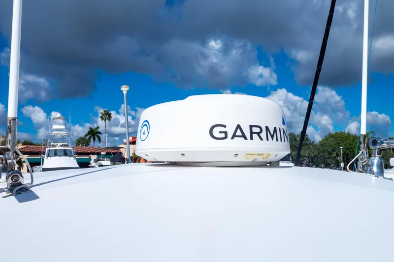  Yacht Photos Pics 2003 Intrepid 370 Cuddy with Garmin radar under a cloudy sky.