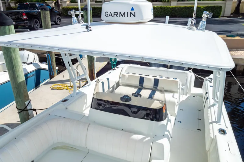  Yacht Photos Pics 2003 Intrepid 370 Cuddy boat with Garmin equipment, docked at marina.