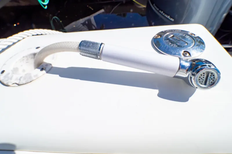  Yacht Photos Pics Close-up of a 2003 Intrepid 370 Cuddy boat's deck shower and water inlet.
