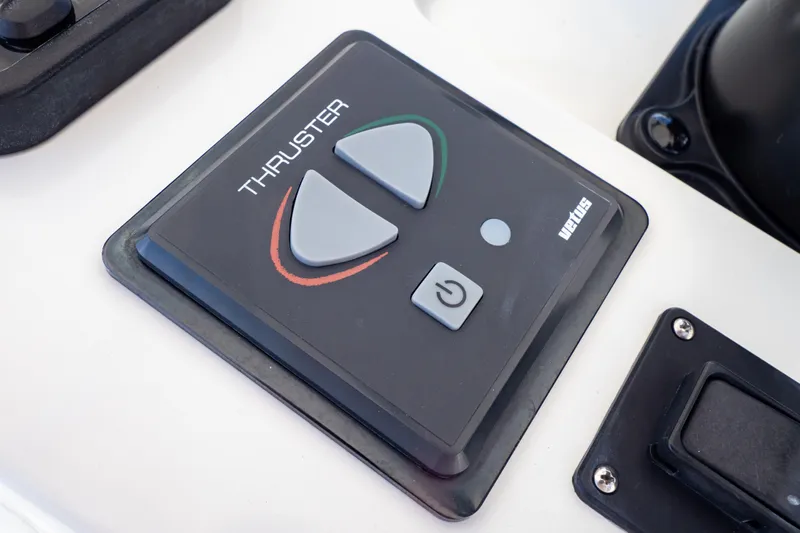  Yacht Photos Pics Control panel of a 2003 Intrepid 370 Cuddy boat with thruster buttons.