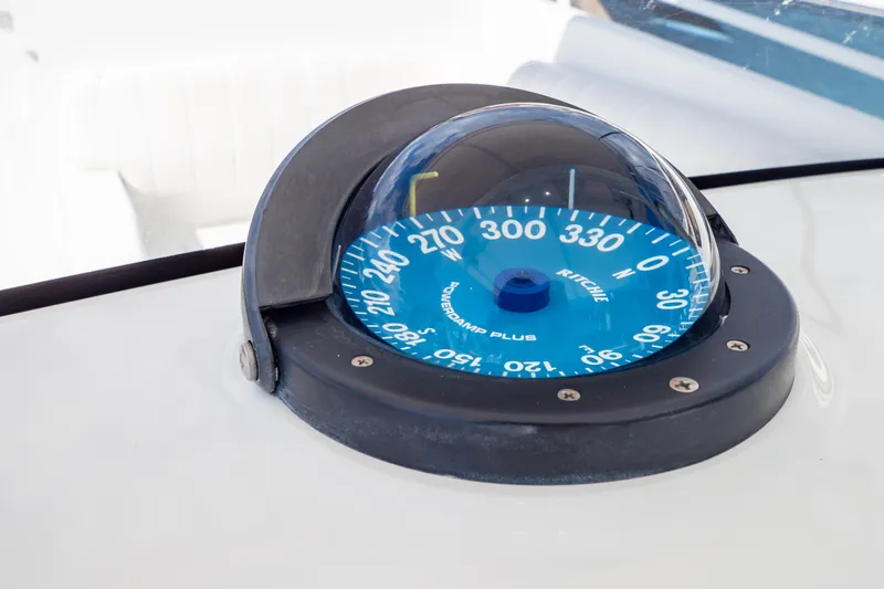  Yacht Photos Pics Compass on 2003 Intrepid 370 Cuddy boat dashboard, featuring Ritchie Powerdamp Plus.