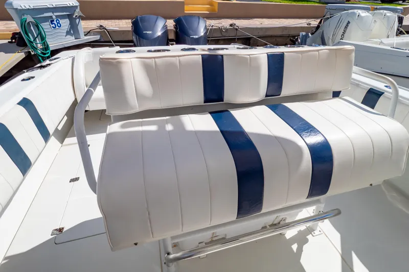  Yacht Photos Pics 2003 Intrepid 370 Cuddy boat seating with blue and white upholstery.