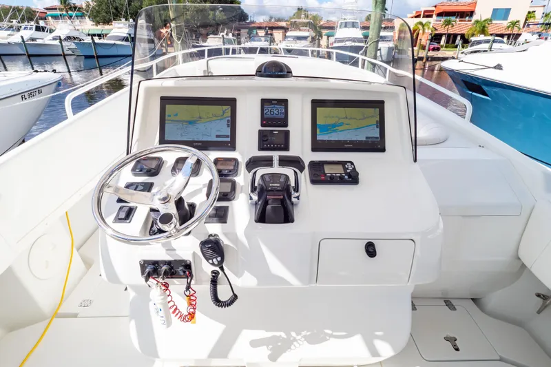  Yacht Photos Pics 2003 Intrepid 370 Cuddy boat helm with navigation screens and controls.
