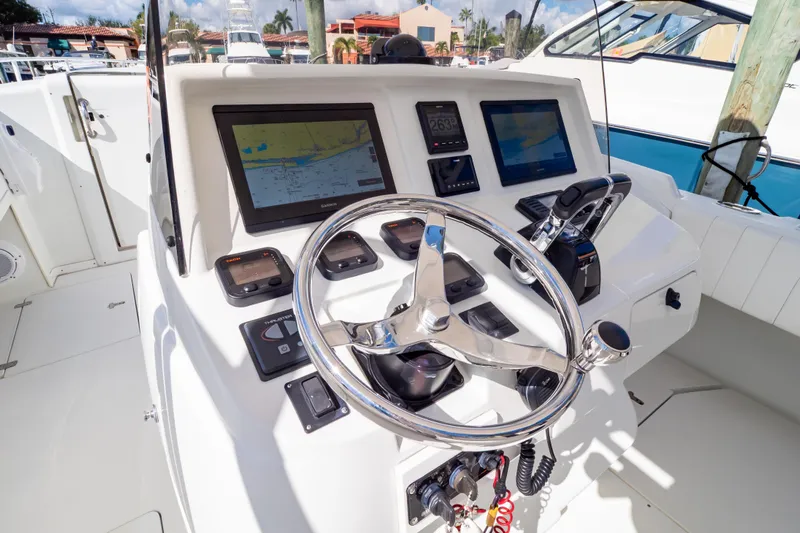  Yacht Photos Pics 2003 Intrepid 370 Cuddy helm with modern navigation displays and controls.