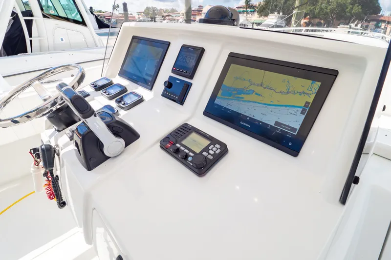  Yacht Photos Pics 2003 Intrepid 370 Cuddy helm with navigation screens and controls.