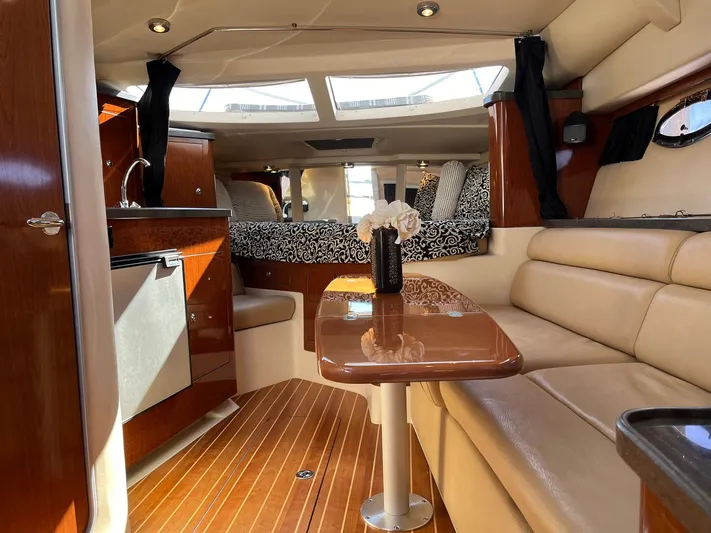 Souper Tuscan Yacht Photos Pics Luxurious interior of a 2011 Regal 35 Express Cruiser with elegant seating and wood finishes.