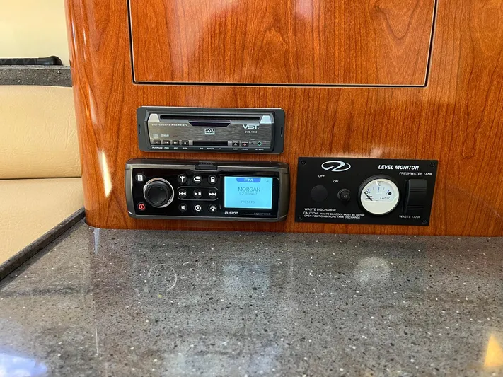 Souper Tuscan Yacht Photos Pics Control panel of 2011 Regal 35 Express Cruiser with audio system and level indicator.