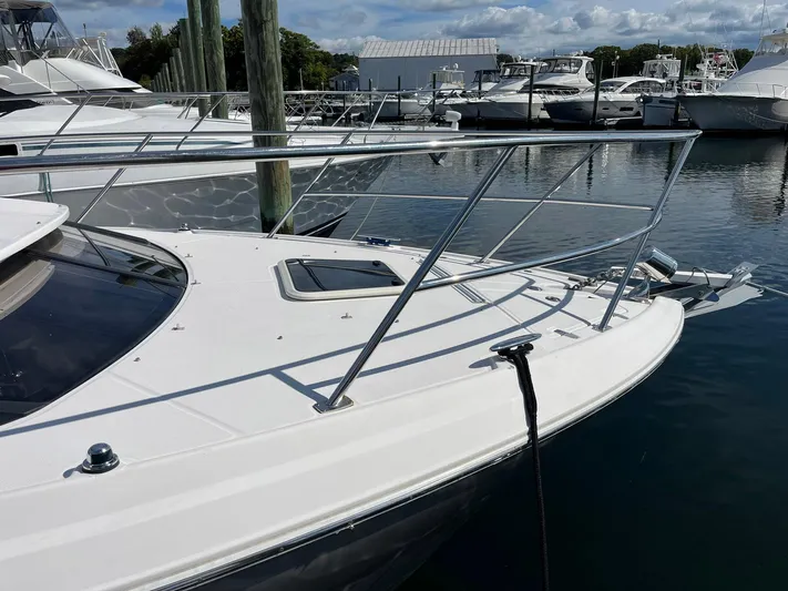 Souper Tuscan Yacht Photos Pics 2011 Regal 35 Express Cruiser docked at marina, showcasing sleek bow design.