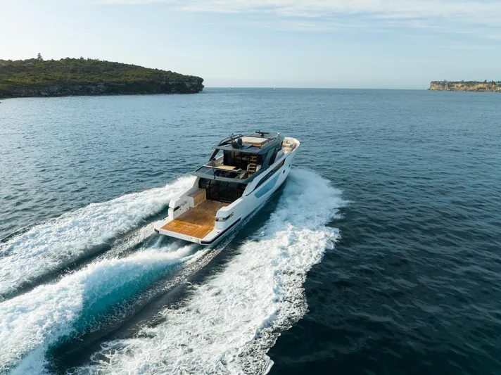 Bgx63 Yacht Photos Pics 2024 Bluegame BGX63 yacht cruising on open sea, showcasing sleek design and powerful performance.