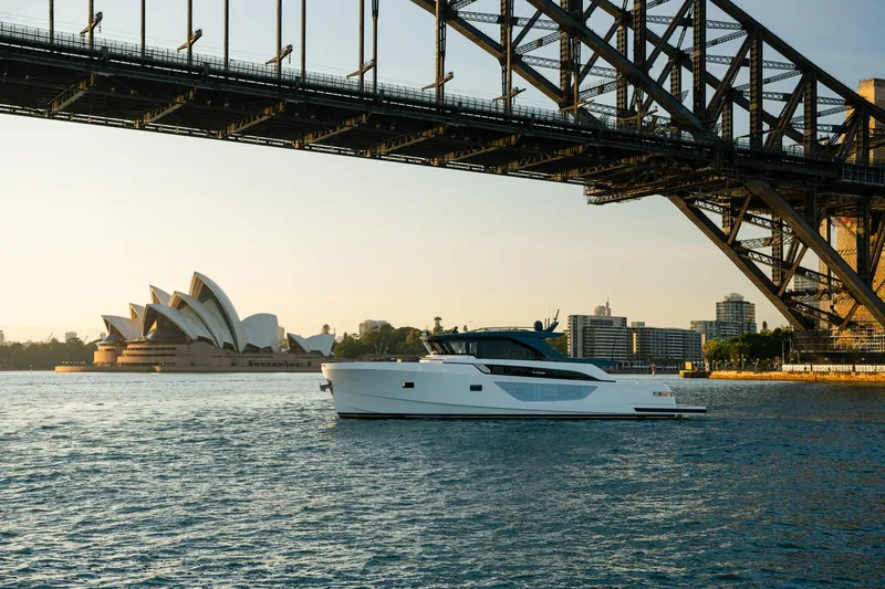 Bgx63 Yacht Photos Pics 2024 Bluegame BGX63 yacht under Sydney Harbour Bridge near Opera House.