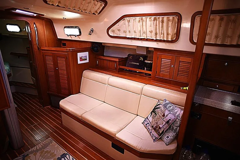 Watermark Lll Yacht Photos Pics Luxurious interior of 2005 Island Packet 445 yacht with comfortable seating and elegant wood finish.