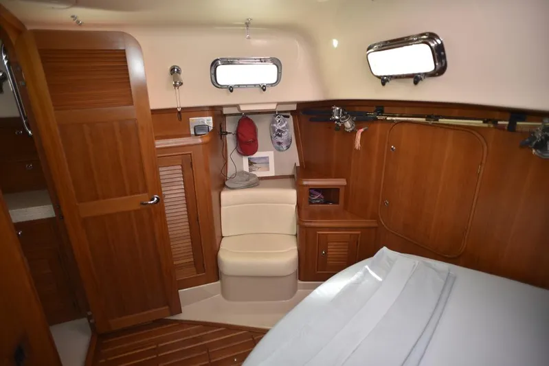 Watermark Lll Yacht Photos Pics Interior of 2005 Island Packet 445 sailboat, featuring wooden cabinetry and seating.