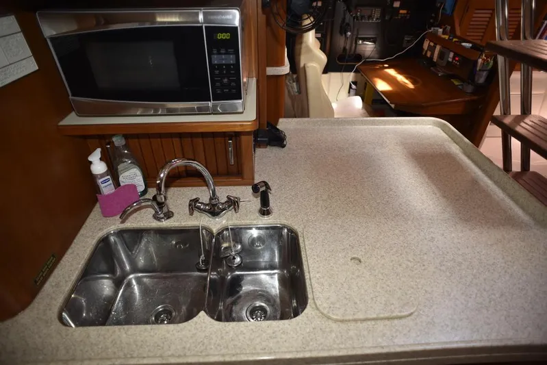 Watermark Lll Yacht Photos Pics Kitchen area of 2005 Island Packet 445 yacht with sink and microwave.