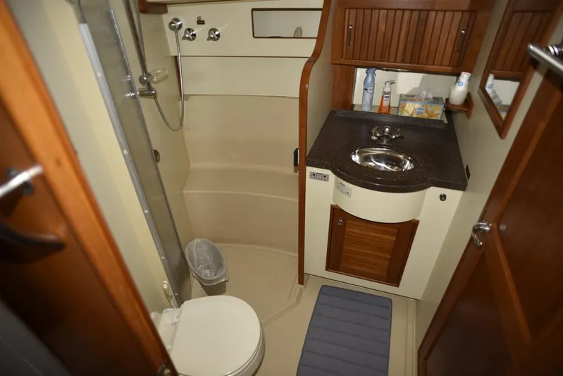 Watermark Lll Yacht Photos Pics Bathroom interior of 2005 Island Packet 445 yacht with shower, sink, and toilet.