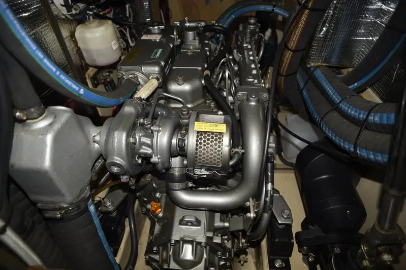 Watermark Lll Yacht Photos Pics Engine compartment of a 2005 Island Packet 445 sailboat, showcasing mechanical components and hoses.