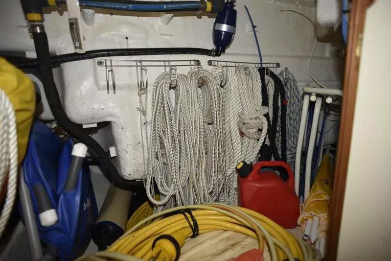 Watermark Lll Yacht Photos Pics Storage area on a 2005 Island Packet 445 sailboat with ropes and equipment.