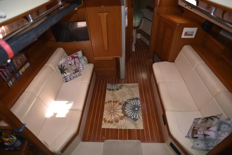 Watermark Lll Yacht Photos Pics Interior of 2005 Island Packet 445 yacht with cozy seating and decorative pillows.