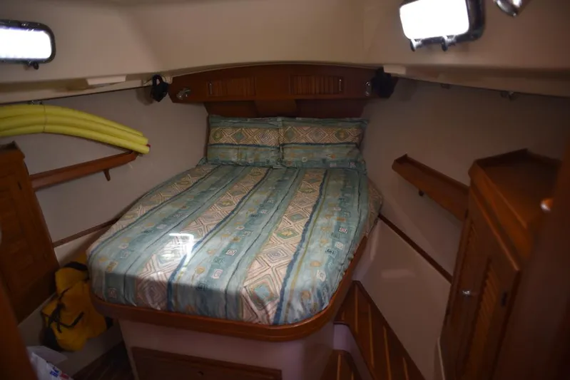 Watermark Lll Yacht Photos Pics Cozy cabin interior of 2005 Island Packet 445 sailboat with patterned bedding.