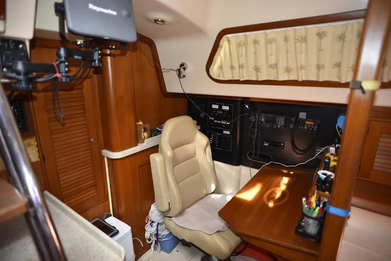 Watermark Lll Yacht Photos Pics Interior of 2005 Island Packet 445 yacht with navigation station and comfortable seating.
