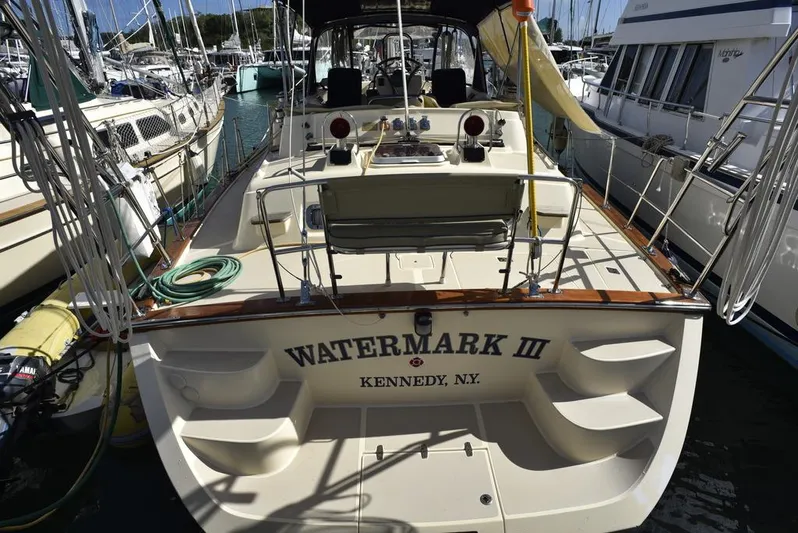 Watermark Lll Yacht Photos Pics Island Packet 445 sailboat, 2005 model, named "Watermark III" docked at a marina.