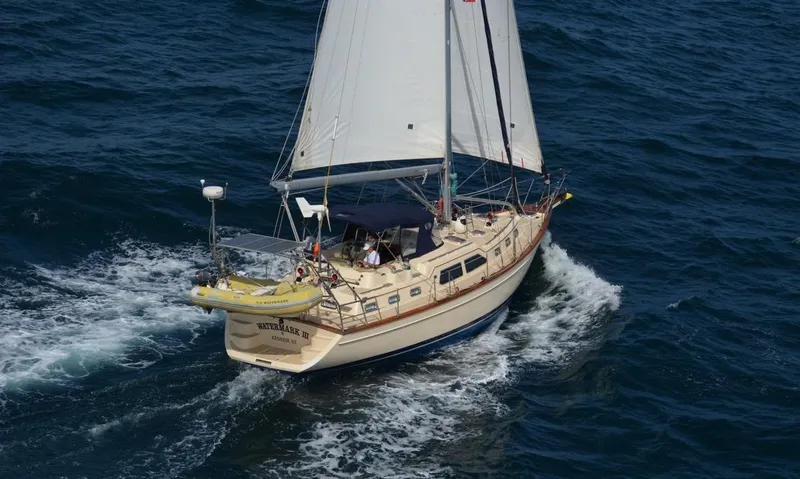 Watermark Lll Yacht Photos Pics Sailing yacht Island Packet 445, 2005 model, navigating through ocean waves.