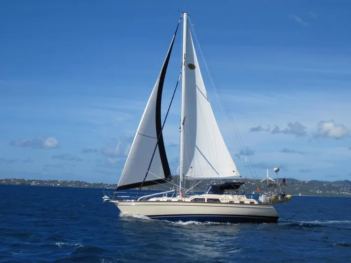 Watermark Lll Yacht Photos Pics Sailing yacht Island Packet 445, 2005 model, cruising on open blue sea.