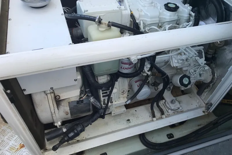 Flip Flops Yacht Photos Pics Engine compartment of a 2017 Leopard 48 yacht, showcasing mechanical components and wiring.