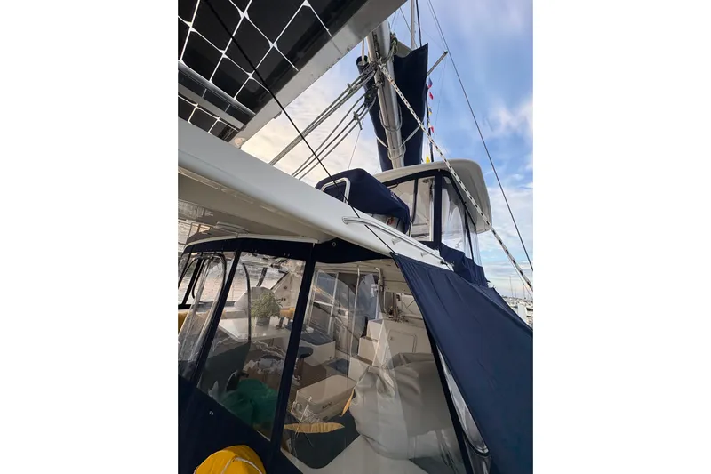 Flip Flops Yacht Photos Pics Sailing yacht Leopard 48, 2017 model, featuring solar panels and covered cockpit area.