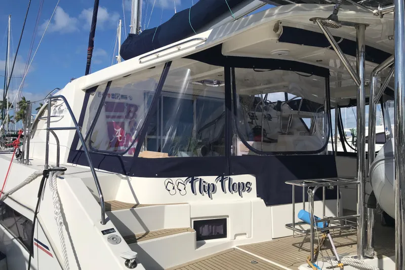 Flip Flops Yacht Photos Pics Leopard 48 yacht, 2017 model, docked with custom "Flip Flops" branding.