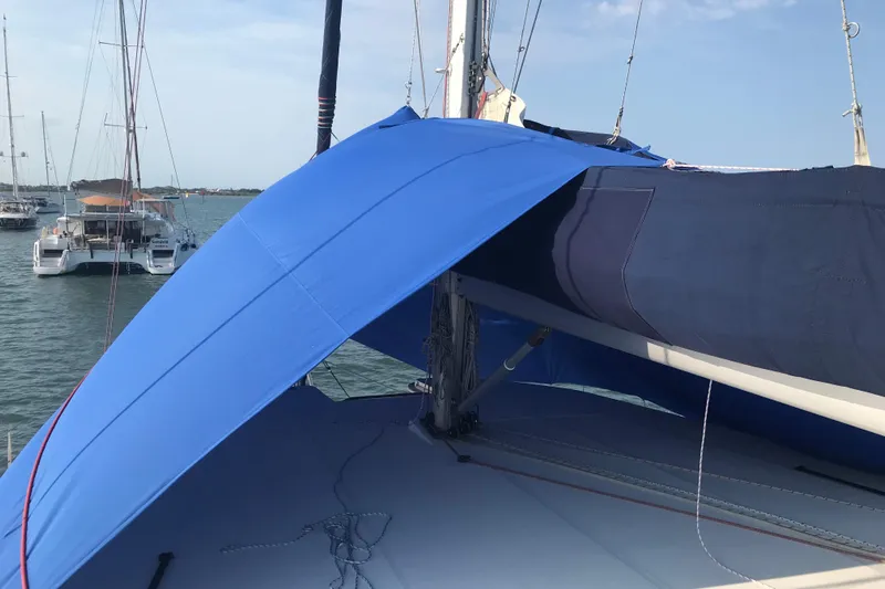 Flip Flops Yacht Photos Pics Sailboat with blue sail cover, Leopard 48 model, anchored in a marina, 2017.