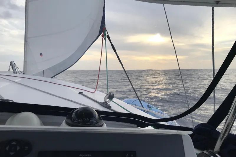 Flip Flops Yacht Photos Pics Sailing on a 2017 Leopard 48 catamaran at sea during sunset.