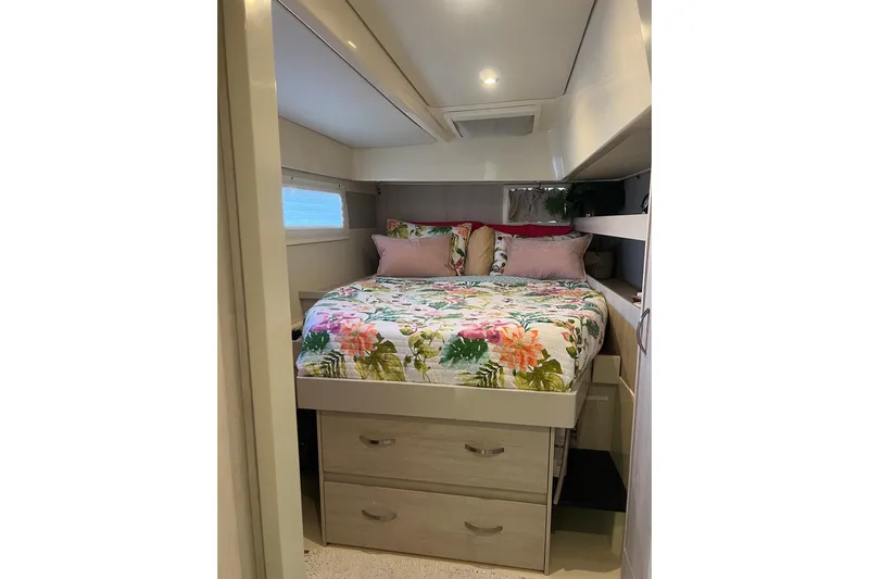 Flip Flops Yacht Photos Pics Cozy bedroom in 2017 Leopard 48 yacht with floral bedding and storage drawers.