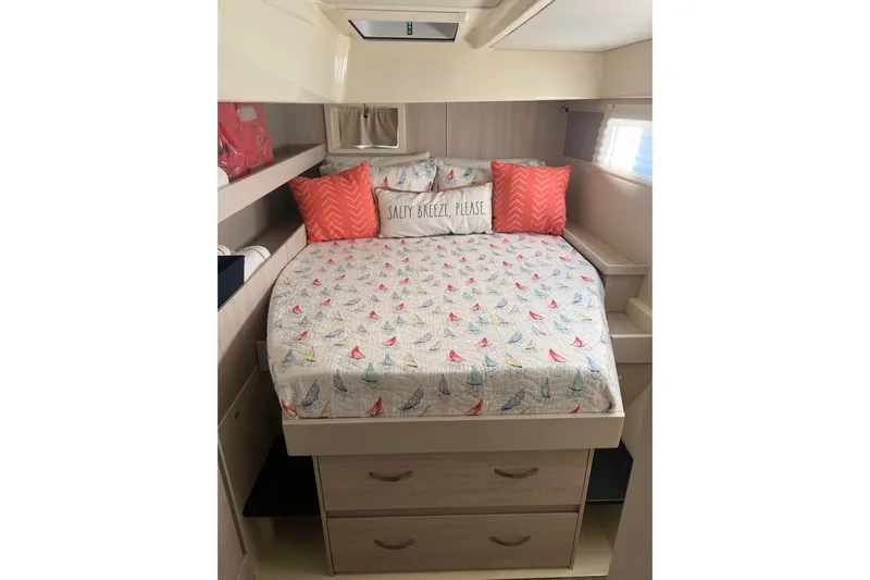 Flip Flops Yacht Photos Pics Cozy bedroom in 2017 Leopard 48 yacht with nautical-themed bedding and pillows.