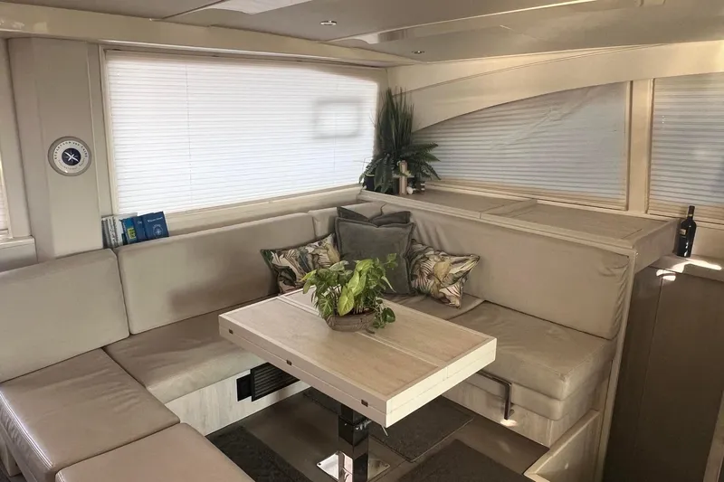 Flip Flops Yacht Photos Pics Luxurious interior of a 2017 Leopard 48 yacht with elegant seating and decor.