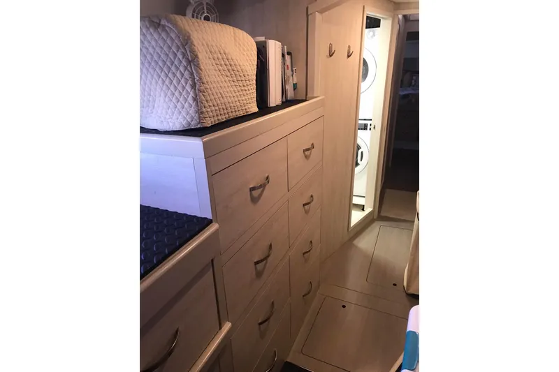 Flip Flops Yacht Photos Pics Interior of 2017 Leopard 48 yacht with storage drawers and laundry area.