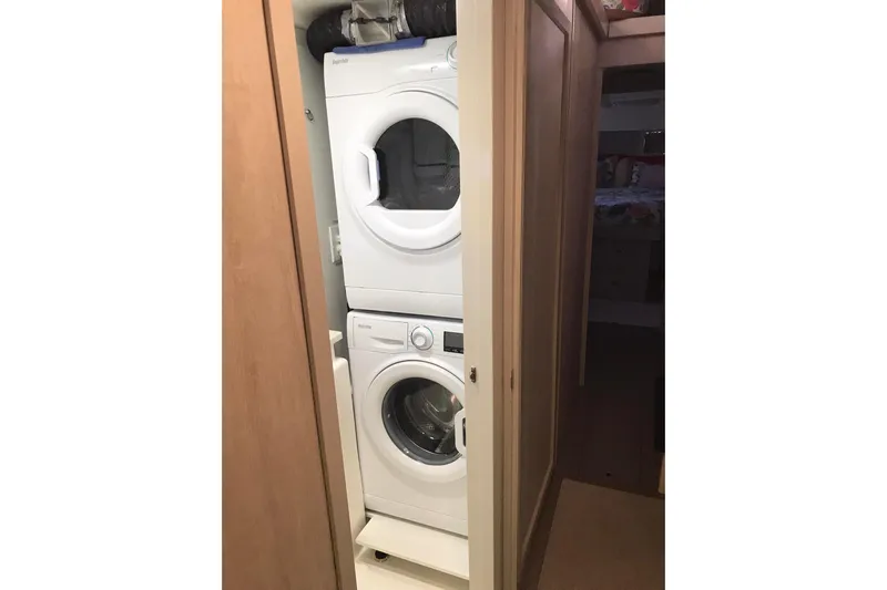 Flip Flops Yacht Photos Pics Stacked washer and dryer in a compact laundry space on a 2017 Leopard 48.