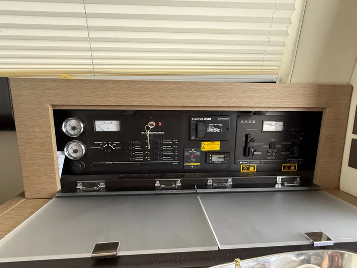 Smiles Away Yacht Photos Pics Control panel of a 2018 Prestige 500 S yacht, featuring gauges and switches.