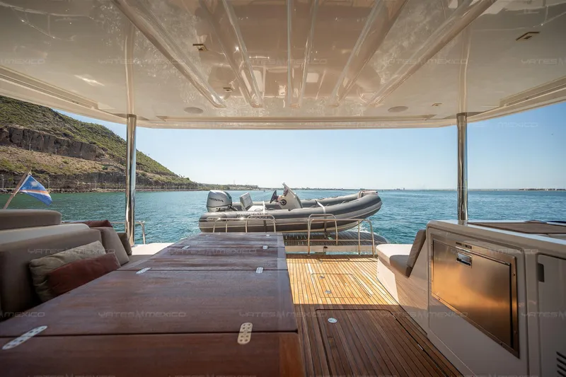  Yacht Photos Pics Luxurious 2023 Lagoon 55 yacht interior with ocean view and inflatable boat.