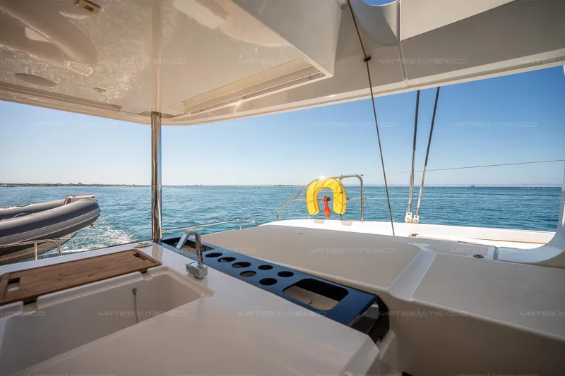  Yacht Photos Pics Luxurious Lagoon 55 yacht deck with ocean view, featuring modern amenities, 2023 model.