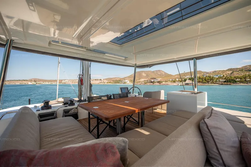  Yacht Photos Pics Luxurious 2023 Lagoon 55 yacht interior with spacious seating and ocean view.